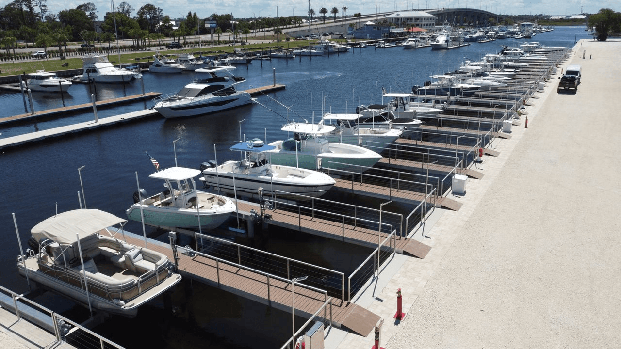 Aerial view of a Northeast Florida marina with rows of boats in covered slips along the waterfront